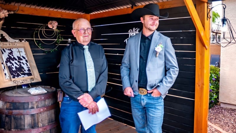 Groom and officiant at wedding ceremony