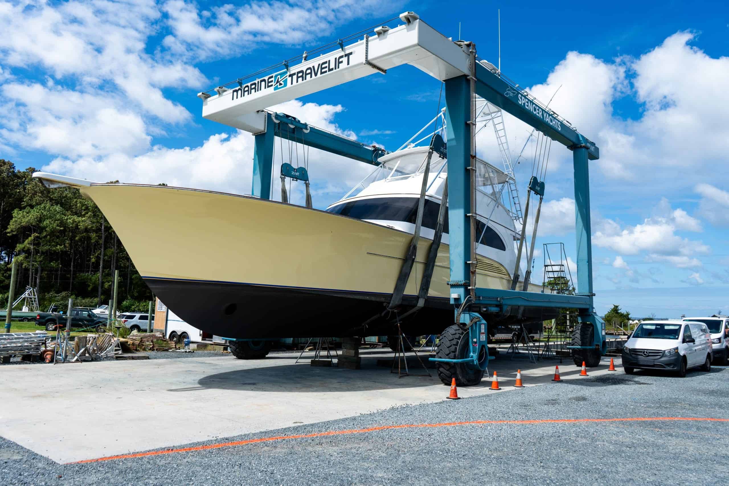 Sportfishing boat being lifted by Spencer Marine travel lift