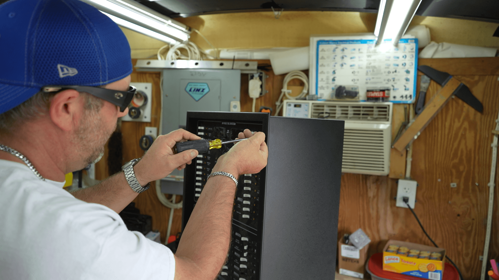 Marine technician wiring electrical control panel
