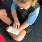 sitting child reading
