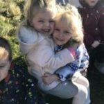 Small girls hugging each other