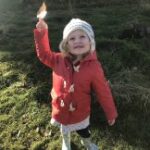Small girl with leaf