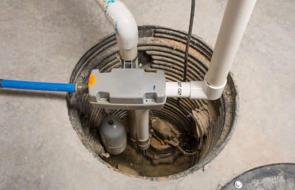 A basement sump pump system installed by Prodigy Sewer and Drain to help prevent flooding and water damage.
