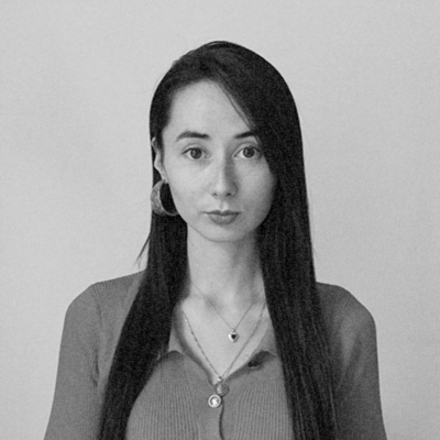 a black and white photo of a woman with long hair