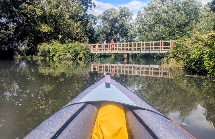Decathlon’s Itiwit 100 Inflatable Kayak Review 2025 6 Kayak approaching bridge