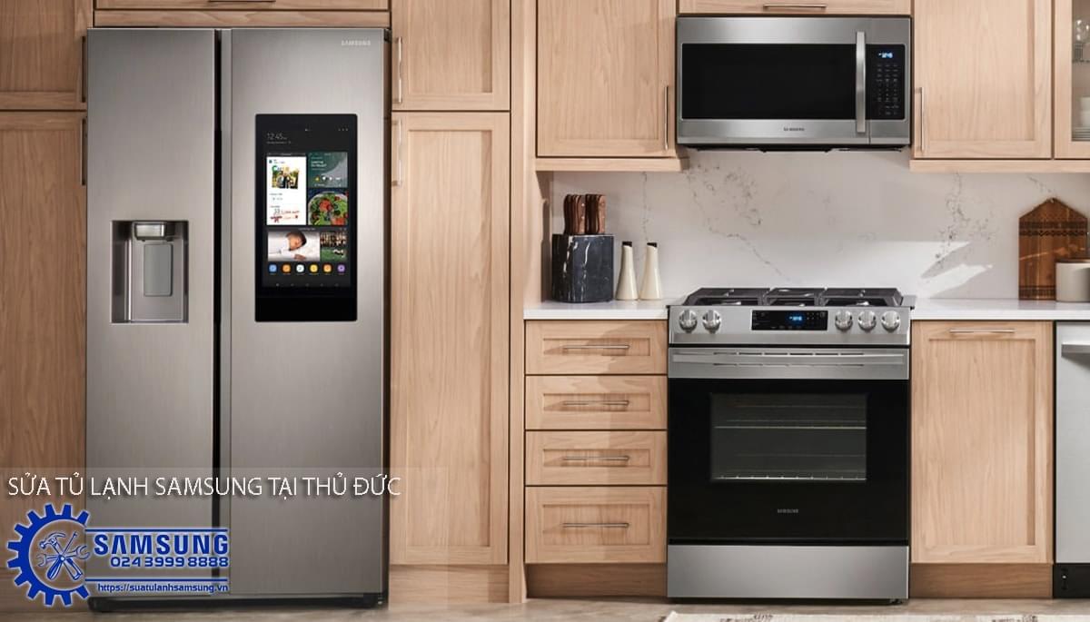 Stainless steel Samsung side-by-side refrigerator in a modern kitchen with built-in oven and microwave for reliable cooling and food preservation.