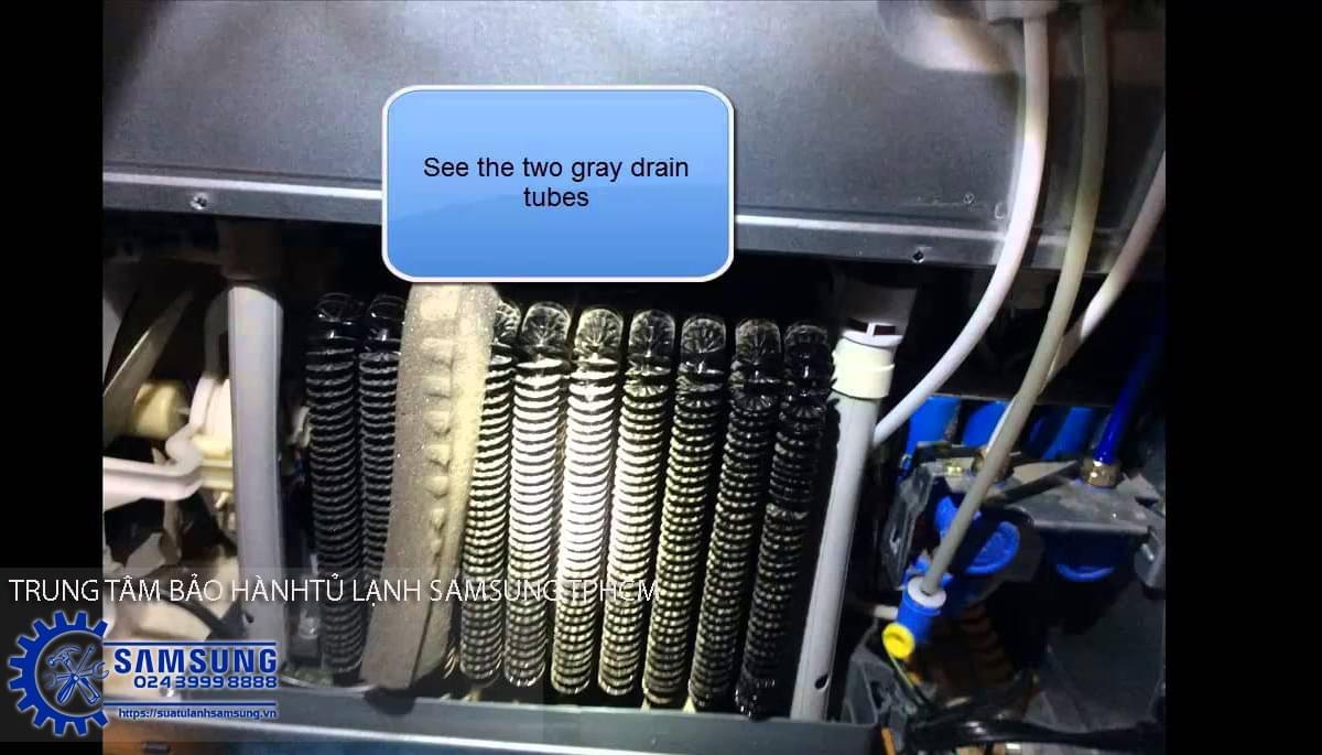 Versatile side-by-side Samsung refrigerator cooling system with gray drain tubes for efficient temperature regulation.