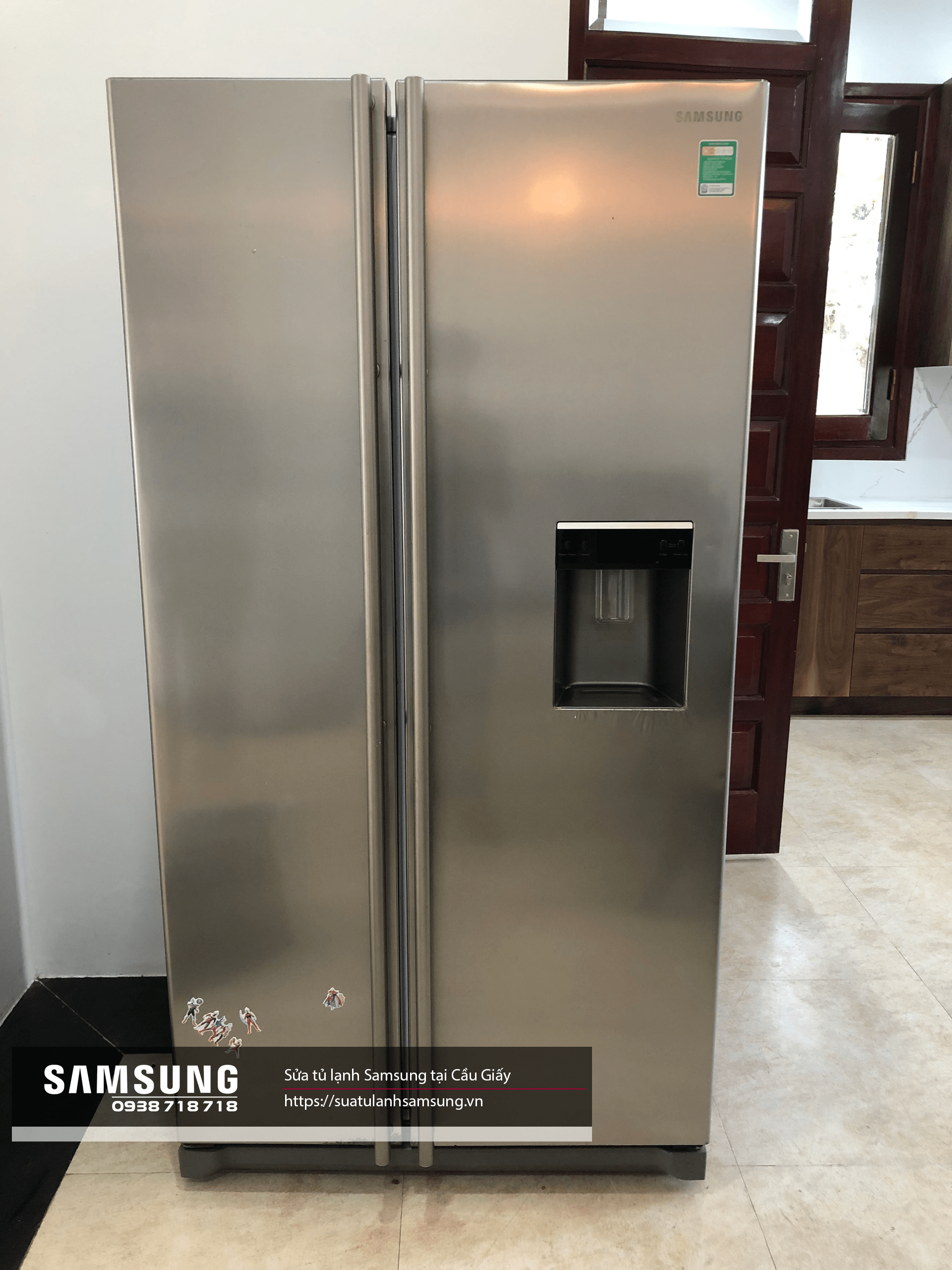 Stainless steel Samsung side-by-side refrigerator with water and ice dispenser for modern kitchen appliances.