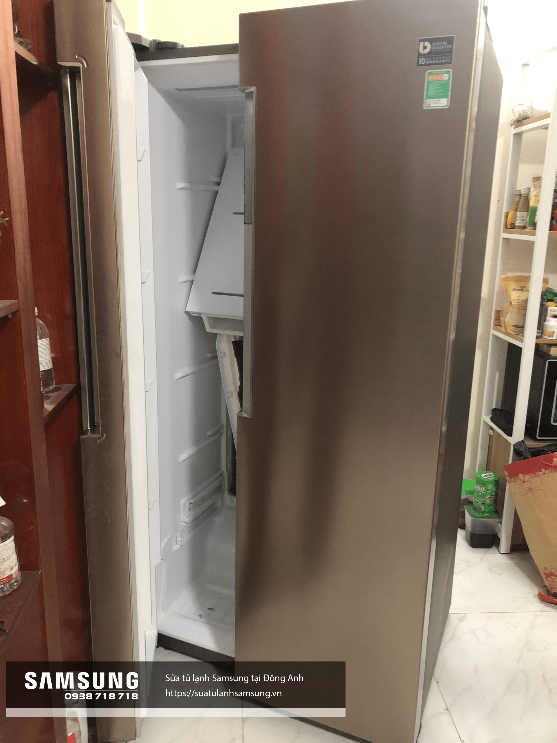 Samsung side-by-side refrigerator with open freezer compartment showing interior and storage shelves, stainless steel finish, ideal for home appliances repair and maintenance.