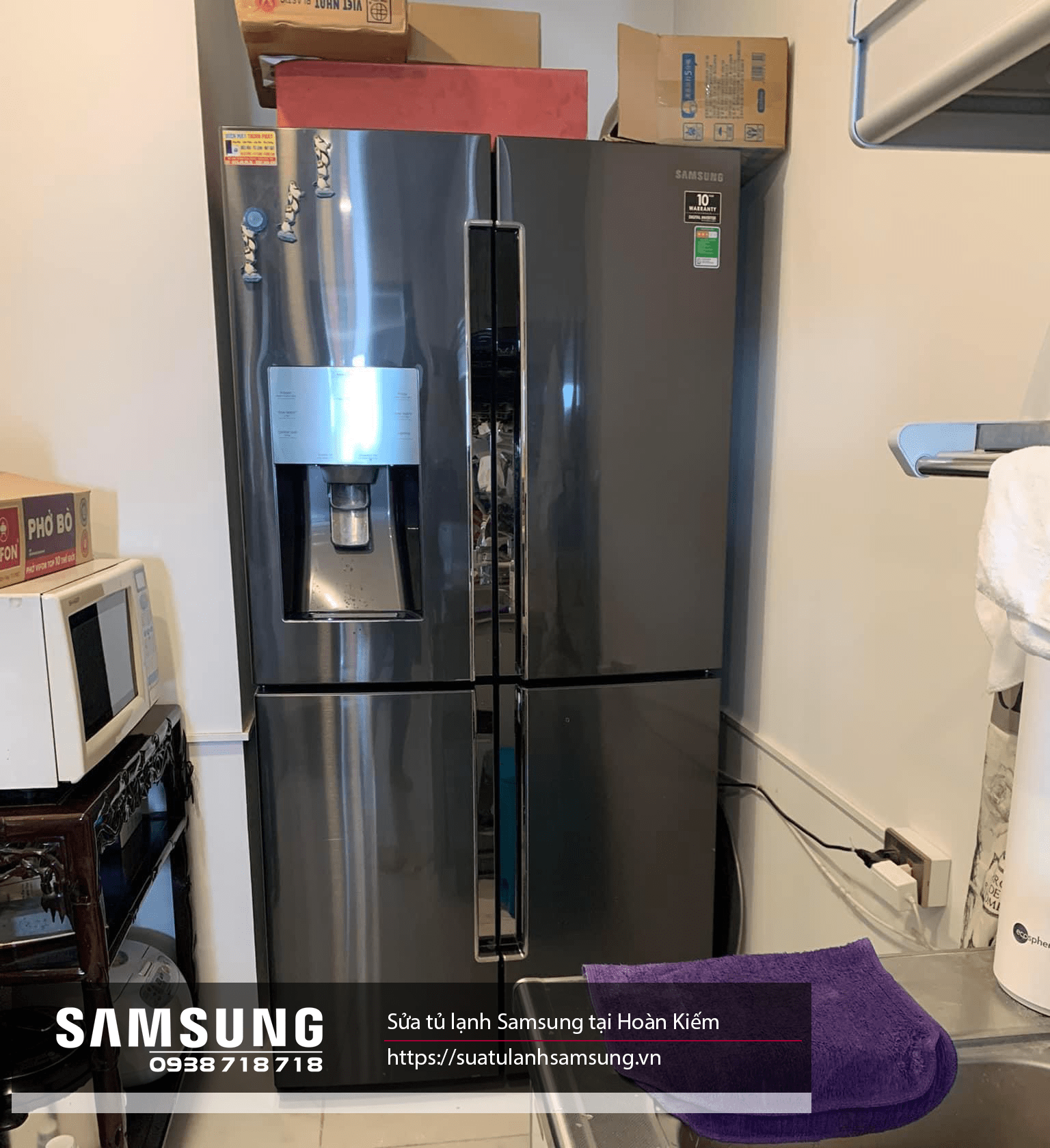 Stainless steel Samsung side-by-side refrigerator with water dispenser, repair service at Hoan Kiem, Hanoi, available contact 024 3999 8888 - 0938 718 718 for professional appliance repairs.