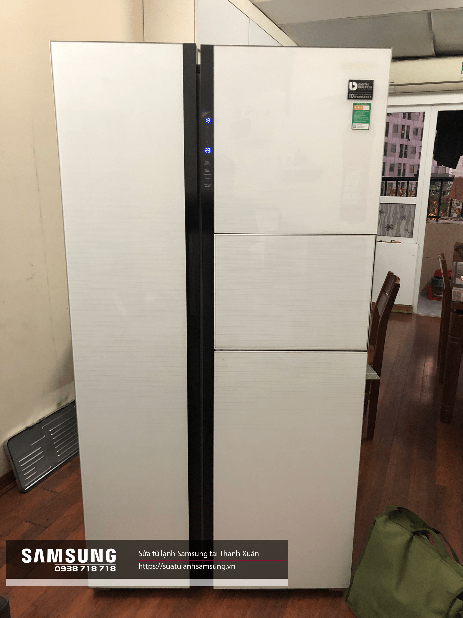 Modern white Samsung side-by-side refrigerator with digital temperature control display, energy-efficient features, ideal for large families, available for repair and servicing in Thanh Xuân.