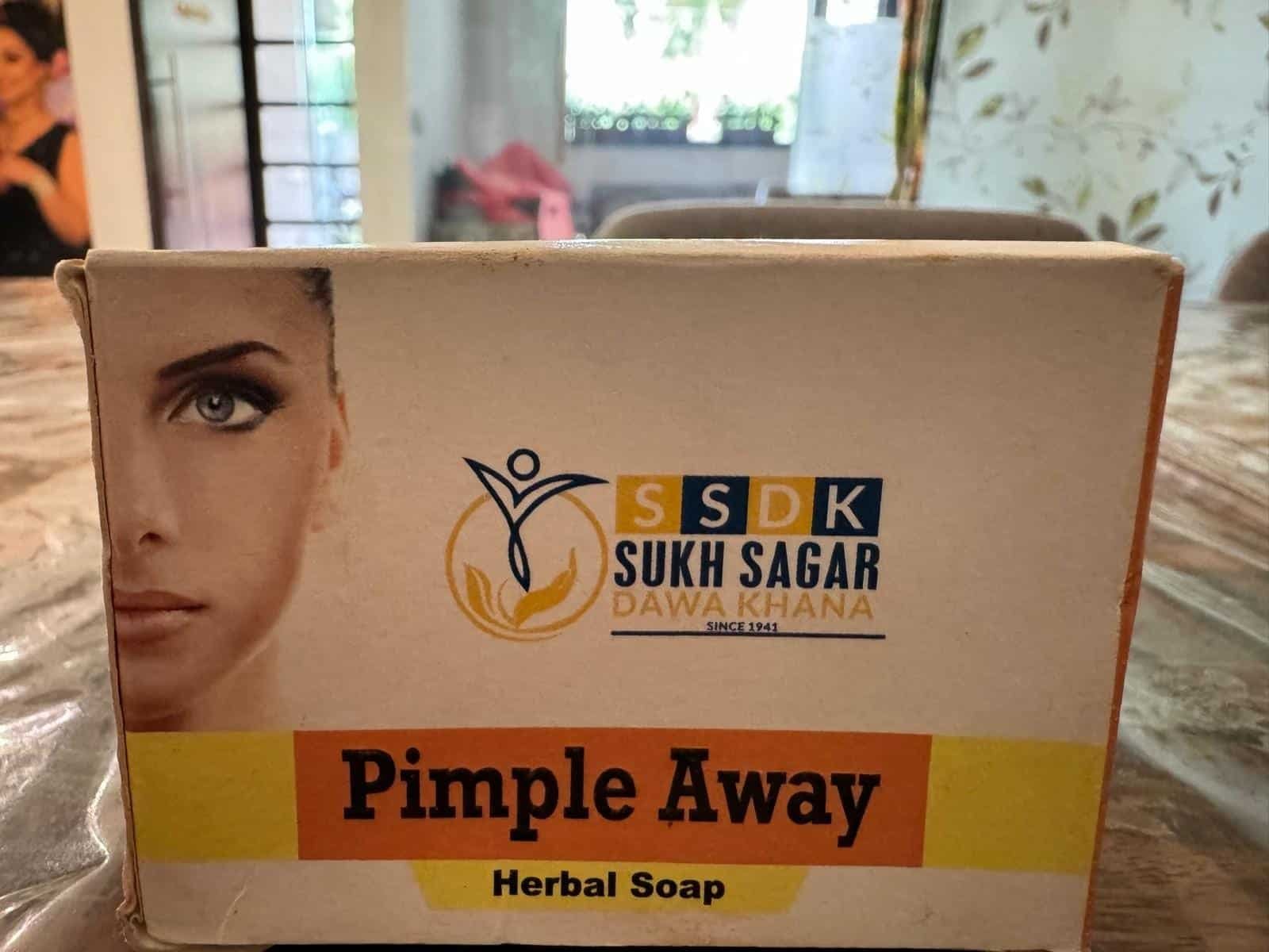 Pimple Away Herbal Soap packaging with Sukh Sagar Dawakhana branding and product name.