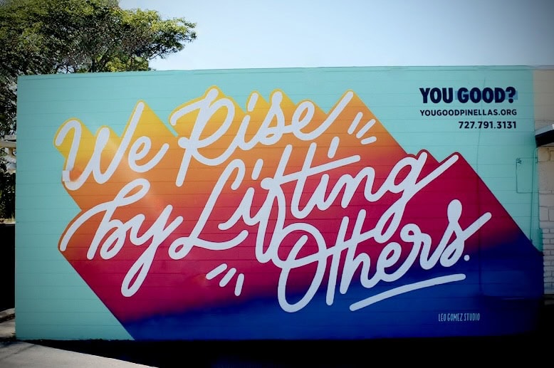 we rise by lifting others mural stpete fl by leo gomez