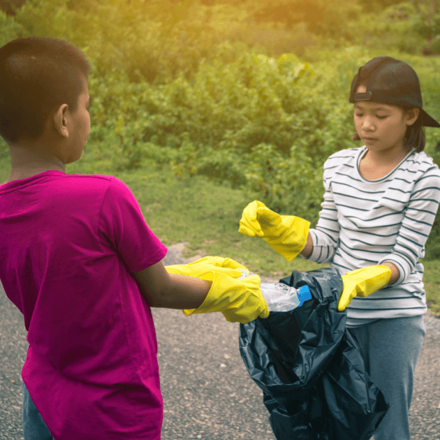 kids picking up trash and taking care of the planet