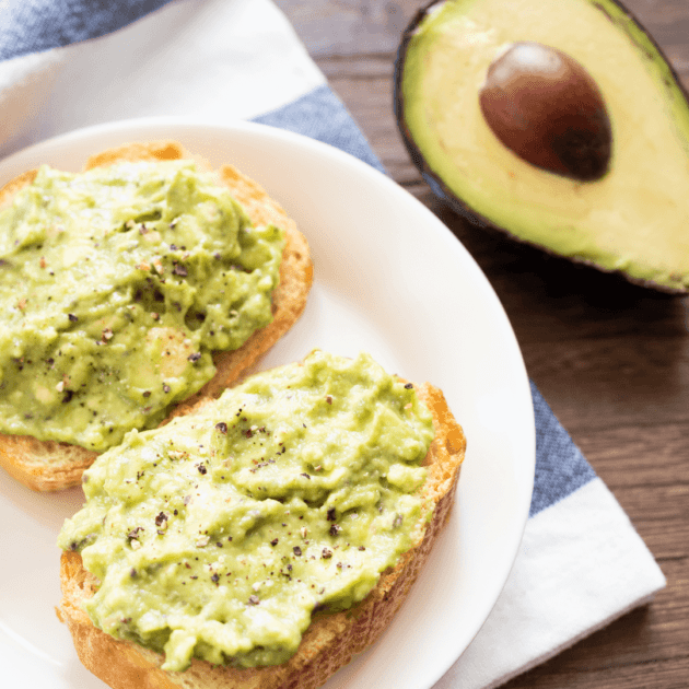two slices of avocado toast and half an avocado which can be mashed with chickpeas for a more protein rich breakfast
