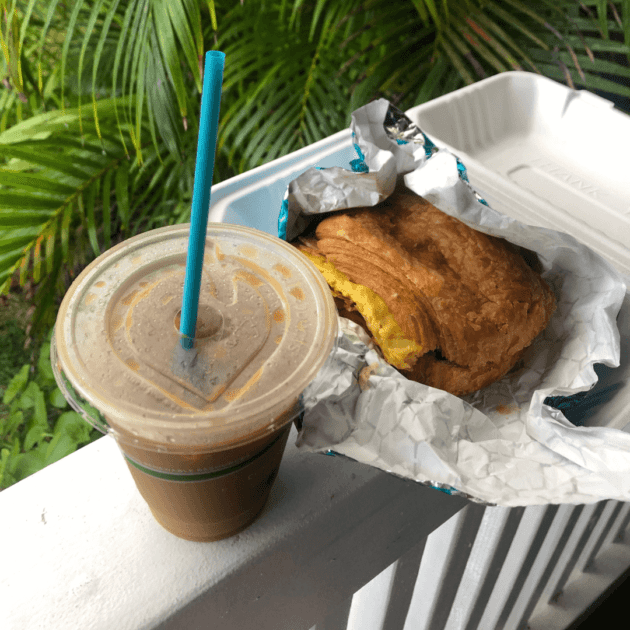 A vegan breakfast sandwich and a vegan iced coffee