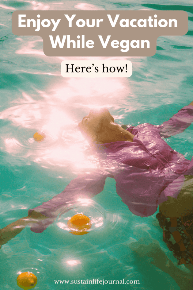 a woman swimming in a pool surrounded by fruit