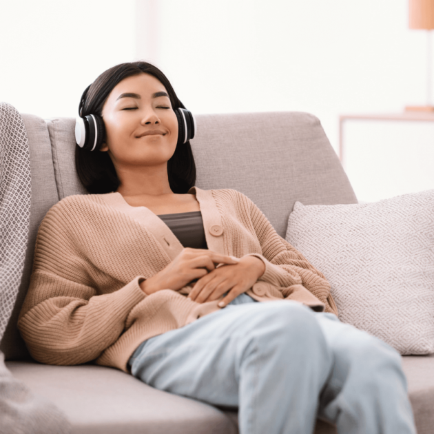 a teenager listening to a meditation on earphones
