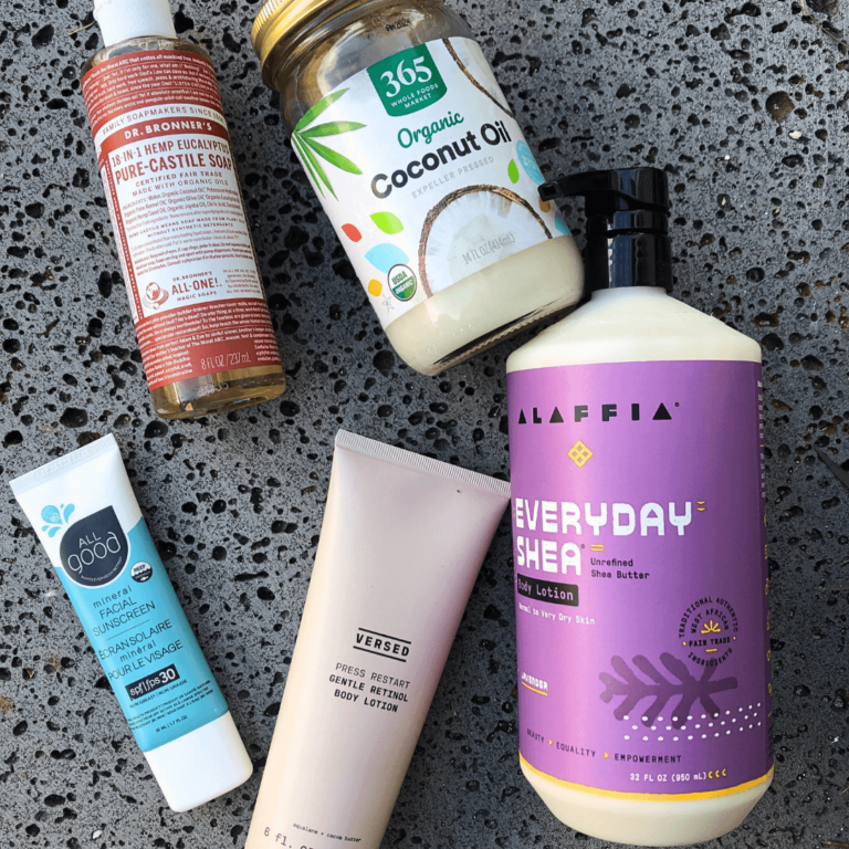 a collection of sustainable body care products laying flat on a rock