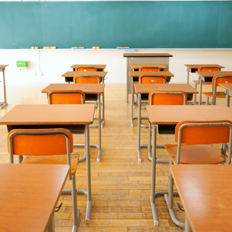 orange and brown desks in a classroom which represents a calming classroom