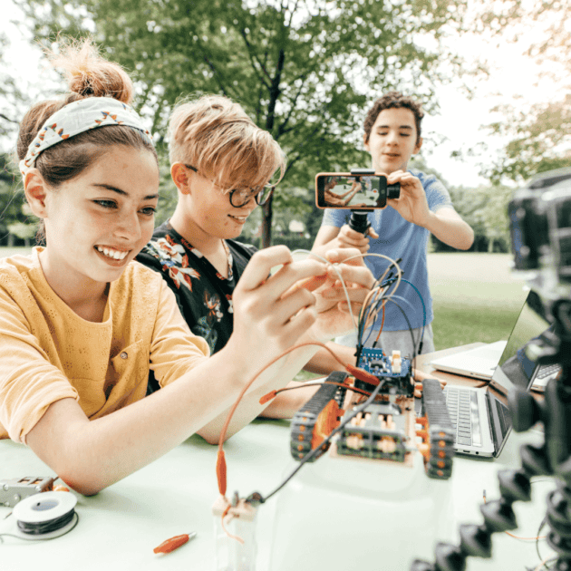 three teenagers making robots as their healthy habit