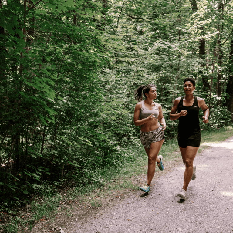 two people jogging together and completing the 75 hard challenge
