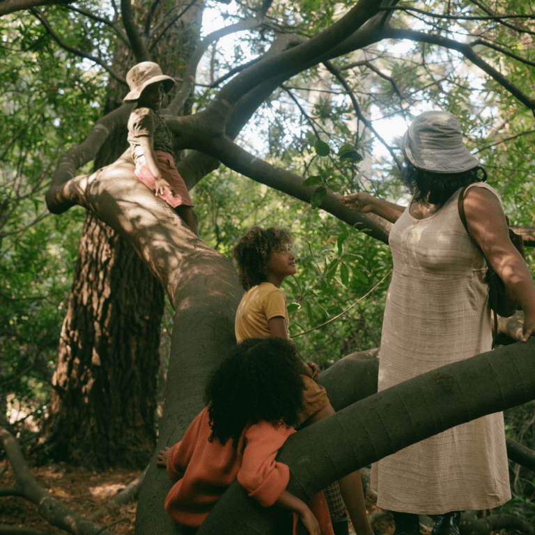 a family playing outside in eco friendly clothing
