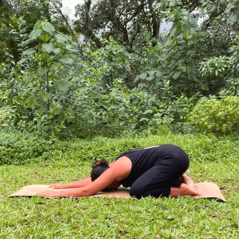a woman doing a basic yoga pose called balasana