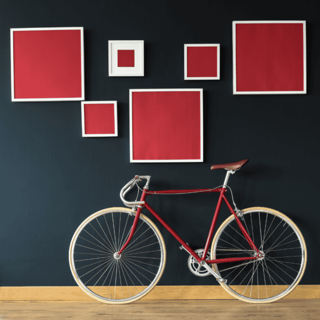 a bike on a leaning wall in a small apartment