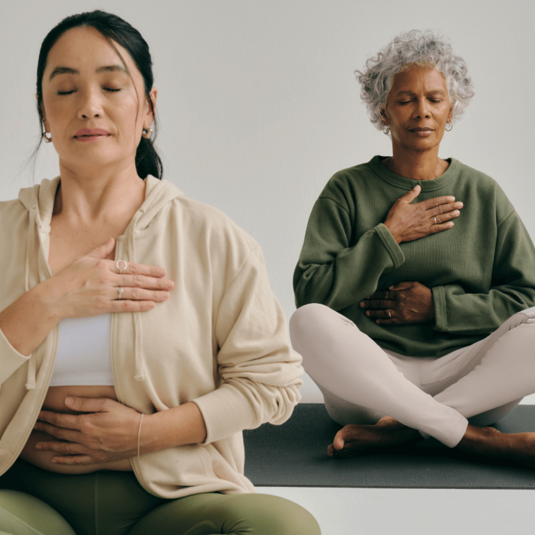 two women sitting in meditation