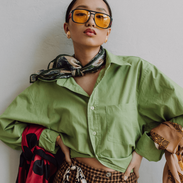 a stylish woman wearing clothes she got at a thrift store