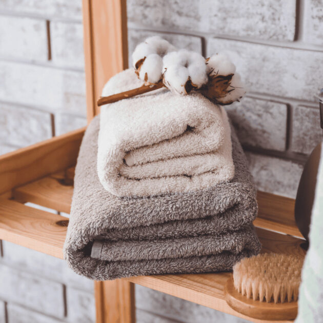 folded towels on a bathroom organizer