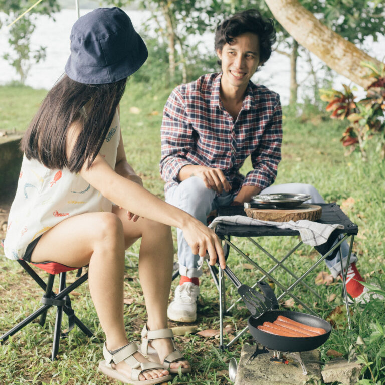 people camping and preparing their food