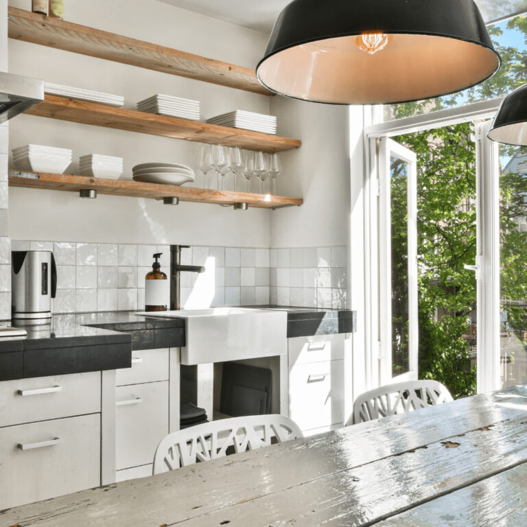 a small, clean and organized kitchen