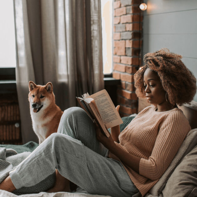 a woman reading for the 75 hard challenge