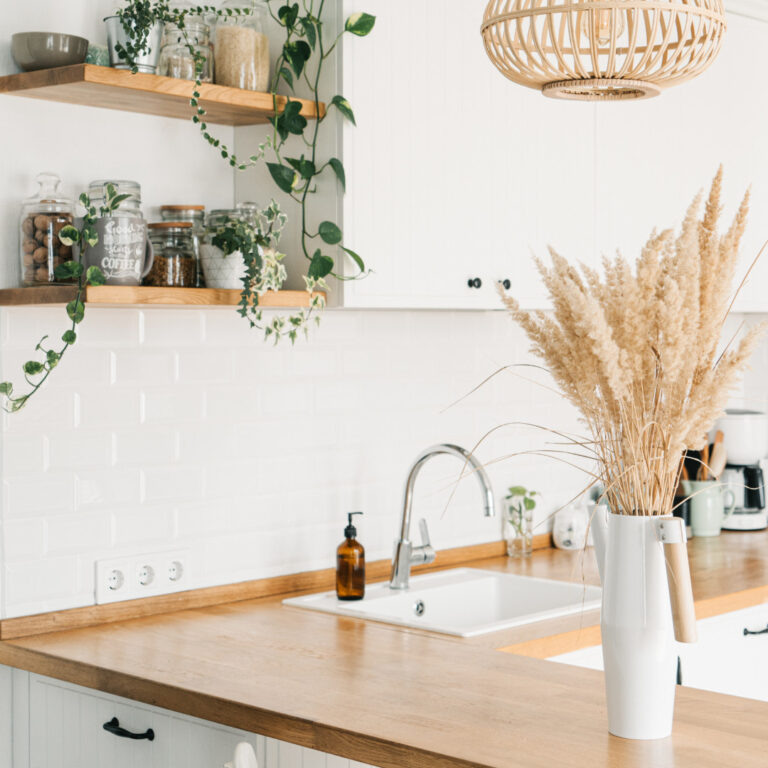farmhouse kitchen with open shelves, dried flowers and butcher block
