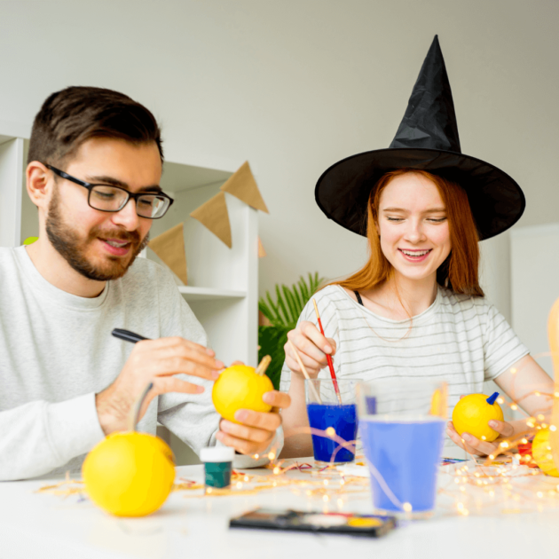 a couple making Halloween crafts