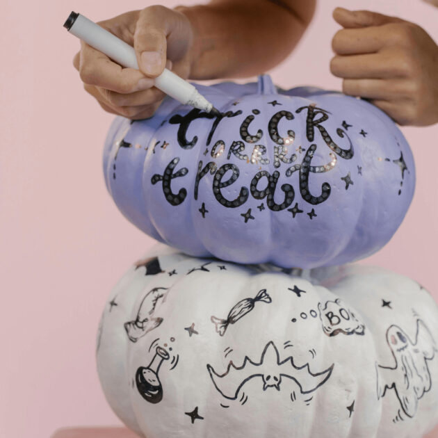 painted Halloween pumpkins as a Halloween party activity