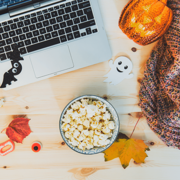 a cozy Halloween movie night with spooky snacks and Halloween decor