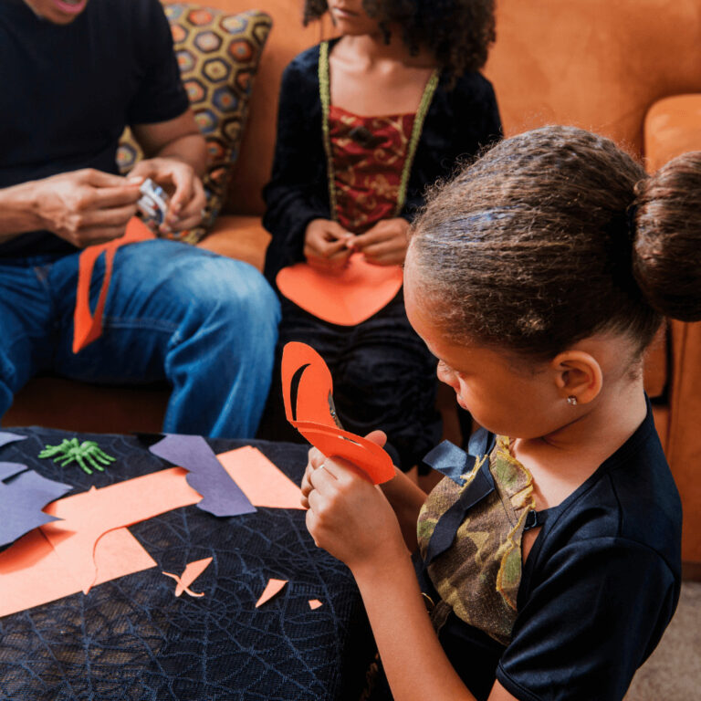 a kid doing a Halloween craft