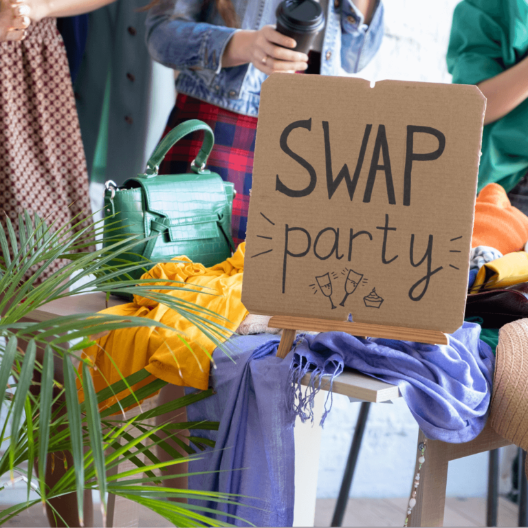 a table of unwanted clothes for a clothing swap party