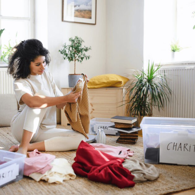 a woman decluttering her room