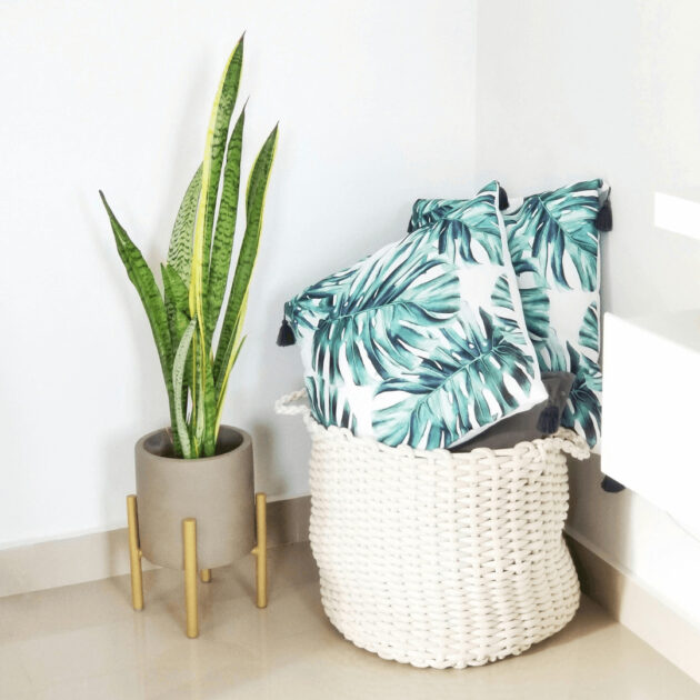basket of pillows and throw blankets