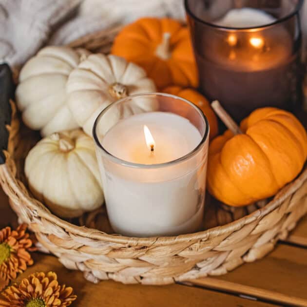 a basket with mini pumpkins for apartment kitchen counter decor
