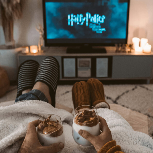 cozy carpet and roommates sitting on a couch