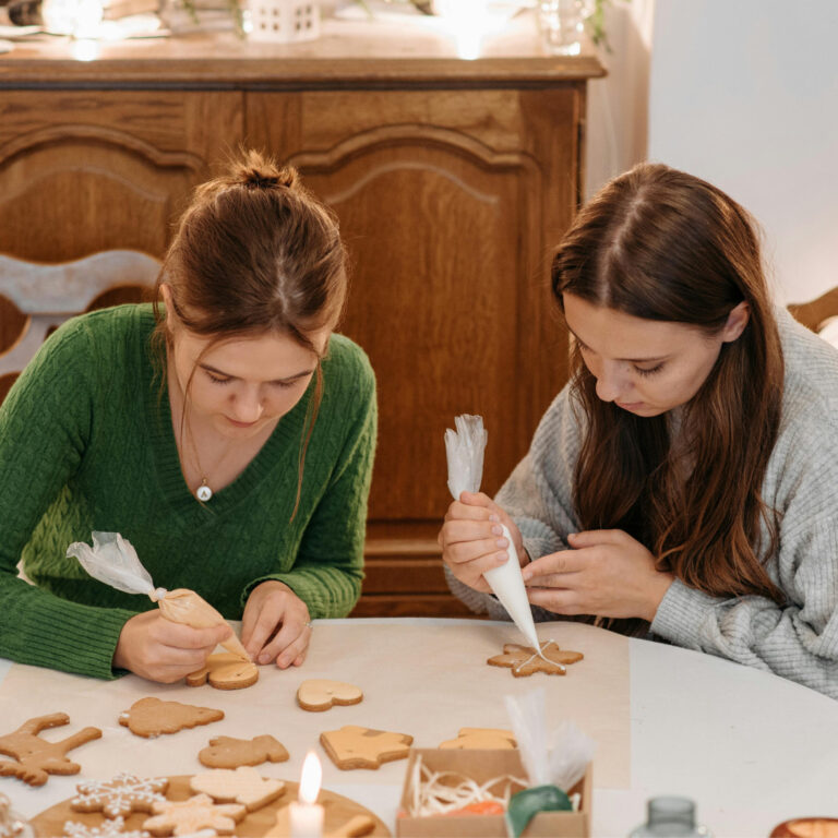 women decorating cookies at a cookie decorating party