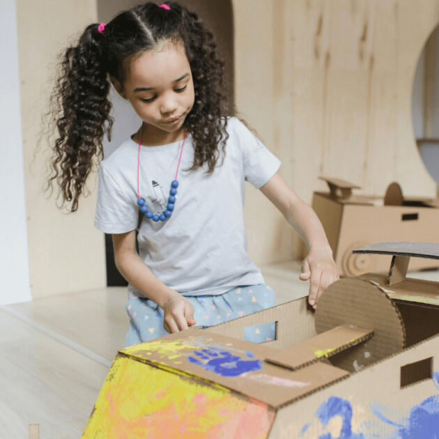 kid creating an upcycled gift