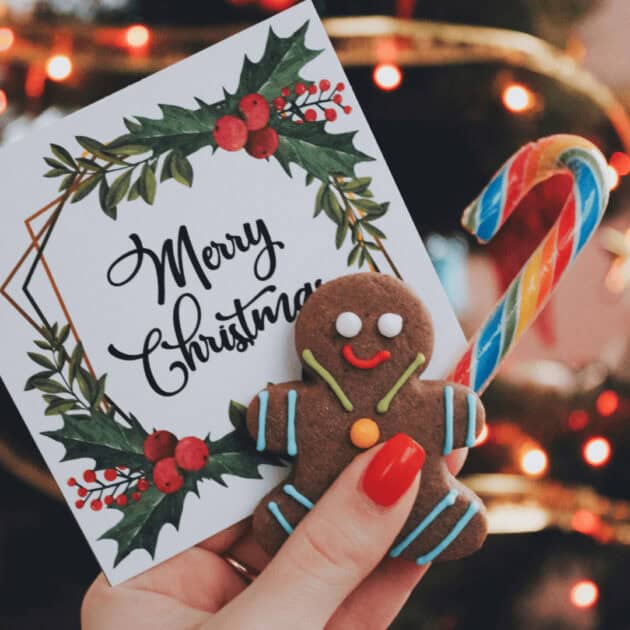 An eco friendly Christmas card, gingerbread man and a candy cane