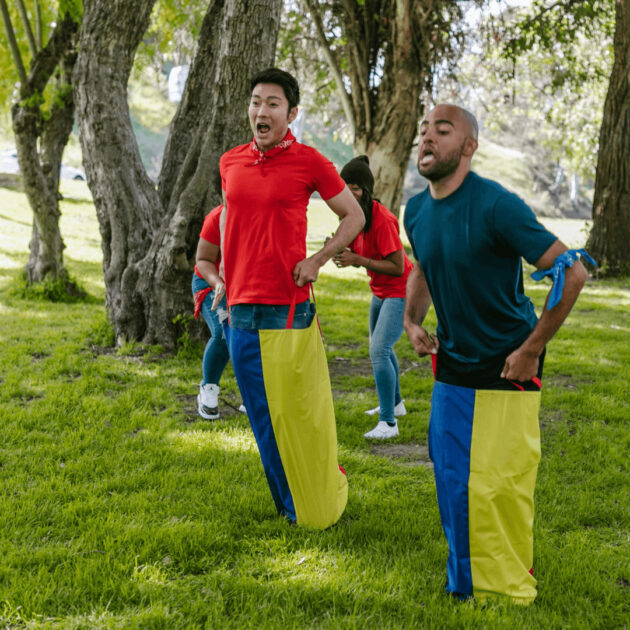 family playing yard games on Thanksgiving day