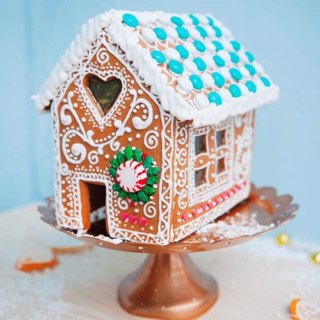 gingerbread house with a heart and candies as decorations